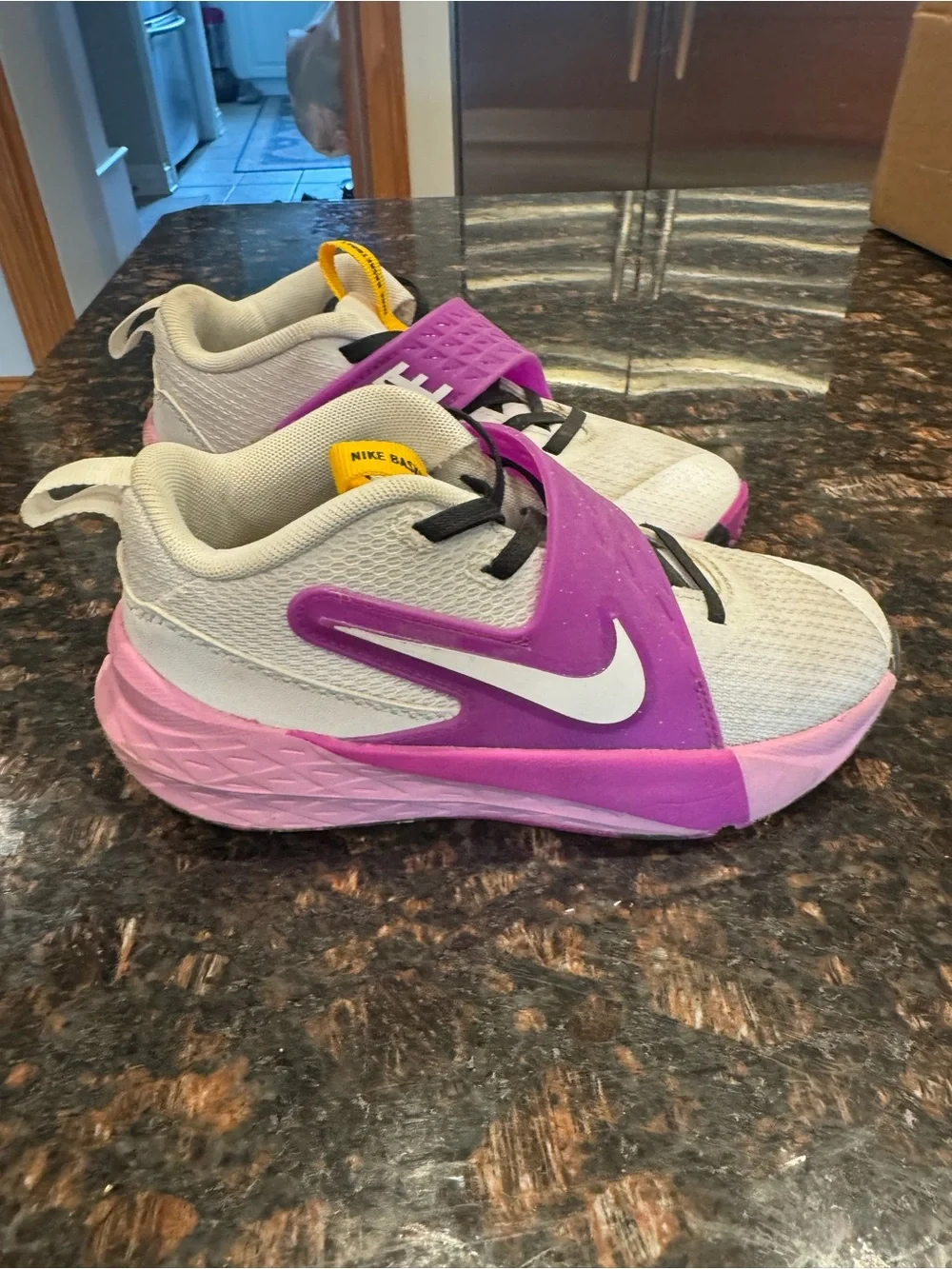 Nike Kids White basketball sneakers with Pink and Purple Accents